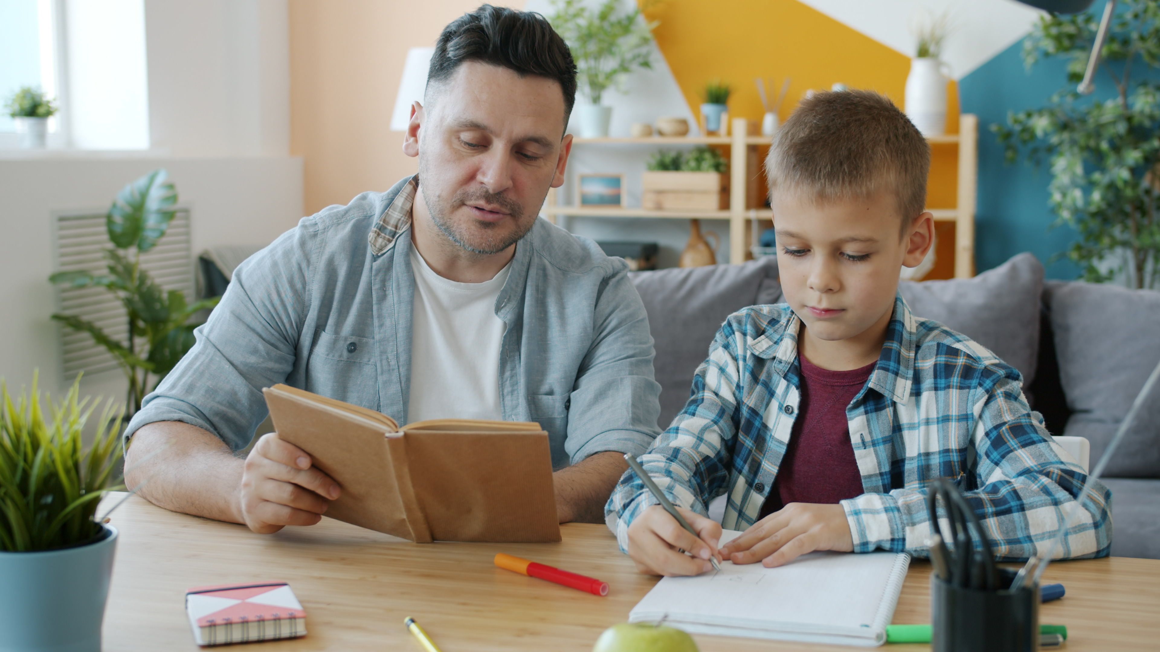 Parent supporting child during evening study and reading